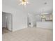 Open-concept living room with tile floors, neutral walls, and views of the kitchen area at 1302 River Oak Dr. # 4B, Myrtle Beach, SC 29579