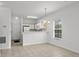 Bright living room with tile flooring, neutral walls, and a view of the kitchen at 1302 River Oak Dr. # 4B, Myrtle Beach, SC 29579