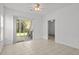 Bright living room featuring tile flooring and sliding glass doors to a private outdoor patio at 1302 River Oak Dr. # 4B, Myrtle Beach, SC 29579