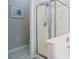 Modern bathroom showcasing a glass shower enclosure with tiled walls and a framed piece of art at 161 Patriot Ln., Pawleys Island, SC 29585