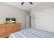Bedroom boasts a large closet, a dresser with a TV, and a comfortable bed with patterned linens at 161 Patriot Ln., Pawleys Island, SC 29585