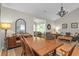 The dining room offers a wooden table, an arched mirror, and views to the living room at 161 Patriot Ln., Pawleys Island, SC 29585