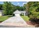 Charming single-story home boasts a well-manicured lawn and a long, inviting driveway at 161 Patriot Ln., Pawleys Island, SC 29585
