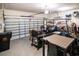 Spacious garage featuring a dining set, grill, golf cart and ample storage space along the walls at 161 Patriot Ln., Pawleys Island, SC 29585