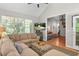 Inviting living room features a large sectional sofa, vaulted ceiling, and view to the next room at 161 Patriot Ln., Pawleys Island, SC 29585