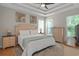 Relaxing main bedroom features a tray ceiling, fan, and a neutral color palette at 161 Patriot Ln., Pawleys Island, SC 29585
