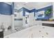 Bathroom with soaking tub and tiled shower, featuring blue walls and modern fixtures at 17 Trigger Fish Ln., Murrells Inlet, SC 29576