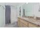 Bathroom featuring a granite vanity, framed botanicals, and shower with curtain at 17 Trigger Fish Ln., Murrells Inlet, SC 29576