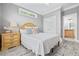 Neutral bedroom featuring a double bed and a wooden accent table at 17 Trigger Fish Ln., Murrells Inlet, SC 29576