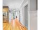 Hallway featuring hardwood floors, white trim, and access to multiple rooms at 17 Trigger Fish Ln., Murrells Inlet, SC 29576