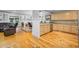 Open floor plan with kitchen featuring granite countertops, natural wood cabinets and seating area at 17 Trigger Fish Ln., Murrells Inlet, SC 29576