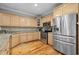 Well-equipped kitchen with stainless steel appliances, granite countertops, and ample storage at 17 Trigger Fish Ln., Murrells Inlet, SC 29576
