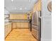 Spacious kitchen with light wood cabinets, stainless steel appliances, and hardwood floors at 17 Trigger Fish Ln., Murrells Inlet, SC 29576