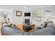 Inviting living room with a fireplace, plush seating, and natural light at 17 Trigger Fish Ln., Murrells Inlet, SC 29576