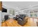 Cozy living room with hardwood floors, fireplace, and a comfortable seating arrangement at 17 Trigger Fish Ln., Murrells Inlet, SC 29576