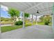 Covered patio overlooking the lawn, trees, and waterway beyond at 17 Trigger Fish Ln., Murrells Inlet, SC 29576