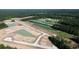 Aerial view of a new construction site with ponds, golf course, and surrounding woods at 170 Bantry Ln., Conway, SC 29526