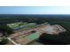 Expansive aerial view of construction site with a golf course, ponds, and wooded surroundings at 170 Bantry Ln., Conway, SC 29526