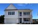Charming two-story home with white siding, black shutters, and a welcoming front porch at 170 Bantry Ln., Conway, SC 29526