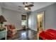 Well-lit bedroom showcasing hardwood floors, a leaf ceiling fan, and a window with decorative blinds at 1737 24Th Ave. N, North Myrtle Beach, SC 29582