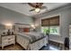 Beautifully decorated bedroom featuring a leaf ceiling fan and window with decorative blinds at 1737 24Th Ave. N, North Myrtle Beach, SC 29582