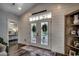 Bright foyer boasts shiplap walls, hardwood floors, and charming decor at 1737 24Th Ave. N, North Myrtle Beach, SC 29582