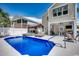 Beautiful backyard pool and spa with outdoor seating and a covered patio area at 1737 24Th Ave. N, North Myrtle Beach, SC 29582