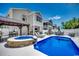 Backyard with a refreshing pool, hot tub, outdoor kitchen, and lounge area at 1737 24Th Ave. N, North Myrtle Beach, SC 29582
