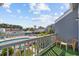 Outdoor balcony view of the community pool area from a private residence at 1890 Colony Dr. # 17L, Surfside Beach, SC 29575