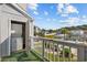 Balcony with washer and dryer with view of landscaped community pool and nearby neighborhood at 1890 Colony Dr. # 17L, Surfside Beach, SC 29575