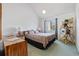 Comfortable bedroom with ample natural light from the window, providing a relaxing retreat at 1890 Colony Dr. # 17L, Surfside Beach, SC 29575