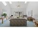 Spacious living room with vaulted ceiling, fan, and sliding glass doors to outdoor deck at 1890 Colony Dr. # 17L, Surfside Beach, SC 29575