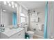 Bathroom features white walls, large sink, a turquoise shower curtain and plenty of storage space at 2006 S Ocean Blvd., North Myrtle Beach, SC 29582