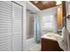 Bathroom featuring vanity, tile floor, and shower with tropical-themed curtain at 2006 S Ocean Blvd., North Myrtle Beach, SC 29582