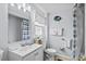 Well-lit bathroom features a shower, window, and a traditional vanity at 2006 S Ocean Blvd., North Myrtle Beach, SC 29582