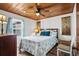 Cozy bedroom with ceiling fan, wood paneled ceiling and nautical themed decor at 2006 S Ocean Blvd., North Myrtle Beach, SC 29582