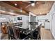 Open dining area adjacent to the kitchen, featuring a large table, wood ceiling, and natural light at 2006 S Ocean Blvd., North Myrtle Beach, SC 29582