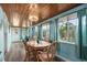 Bright dining room with wood-paneled ceiling and large windows bringing the outdoors in at 2006 S Ocean Blvd., North Myrtle Beach, SC 29582