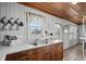 Kitchen showcasing a sink, wood cabinets, and natural light from the windows at 2006 S Ocean Blvd., North Myrtle Beach, SC 29582