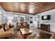 Relaxing living room featuring wood paneling and comfortable sofas at 2006 S Ocean Blvd., North Myrtle Beach, SC 29582