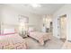 Bright bedroom featuring two twin beds, ceiling fan, and access to en suite bathroom at 2180 Waterview Dr. # 1036, North Myrtle Beach, SC 29582