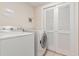 Laundry room with washer, dryer, and white bi-fold closet doors at 2180 Waterview Dr. # 1036, North Myrtle Beach, SC 29582