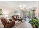 Inviting living room featuring wood floors, leather furniture, and balcony access at 2180 Waterview Dr. # 1036, North Myrtle Beach, SC 29582
