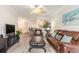 Inviting living room featuring wood floors, leather furniture, and stylish decor at 2180 Waterview Dr. # 1036, North Myrtle Beach, SC 29582