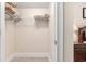 Walk-in closet with white shelving, carpet flooring, and ample storage space at 2180 Waterview Dr. # 1036, North Myrtle Beach, SC 29582