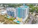 Aerial view of a high rise condo building and pool with city and beach views at 2301 S Ocean Blvd. # 1405, North Myrtle Beach, SC 29582