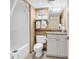 Compact bathroom features a shower-tub combo and white vanity at 2301 S Ocean Blvd. # 1405, North Myrtle Beach, SC 29582