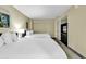 Cozy bedroom with two beds, flatscreen tv, closet, and neutral decor at 2301 S Ocean Blvd. # 1405, North Myrtle Beach, SC 29582