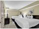 Cozy bedroom featuring two beds, TV, and lamps for a comfortable stay at 2301 S Ocean Blvd. # 1405, North Myrtle Beach, SC 29582
