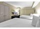 Comfortable bedroom with two queen beds, dresser, and closet space at 2301 S Ocean Blvd. # 1405, North Myrtle Beach, SC 29582